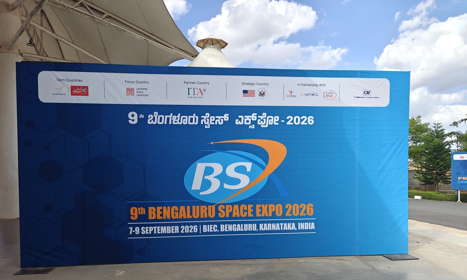 The entrance signage of Bengaluru Space Expo 2026 at BIEC, listing Australia and the United Kingdom as tech countries, Japan as focus country, Italy as partner country and the United States as strategic country.